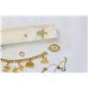 Image 2 : GOLD TONE CHARM BRACELET WITH CHARMS AND OTHER JEWELLRY