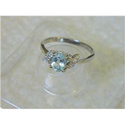 RING - OVAL FACETED LIVELY SKY BLUE TOPAZ & 2 DIAMONDS IN STERLING SILVER SOLITAIRE DESIGNED SETTING