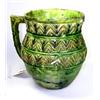 Image 1 : A green glazed jug, the flared rim and ovoid body decorated with three raised and yellow painted ch.