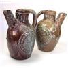 Image 1 : 'Temp. Henry I', two mauve spouted jugs decorated with blue roundels quartered by crosses, chevrons.