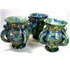 Image 1 : 'Remember Me As I Doe Thee', three four handled blue mugs, the baluster shapes with raised yellow l.