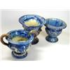 Image 1 : Three blue campana urns, one with scrolling foliage between the brown ring handles, 12cm diameter (.