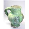Image 1 : A matt green mug applied with yellow and blue rose between blue vine scrolls below the reeded neck,.