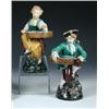 Image 1 : A pair of Minton majolica 'Hogarth Match' figures, datecodes for 1868 and 1869, both seated on mott.