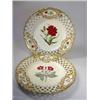 Image 1 : A pair of mid 19th century plates painted with cut flowers in gilt vignettes on the diamond lattice.