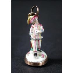 An 18th century figural seal, possibly Chelsea or Girl In the Swing, modelled as Pulchinello standin