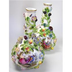 A pair of early 20th century Carl Thieme of Potschappel bottle vases, each encrusted with flowers a.
