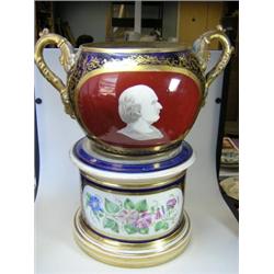 A mid 19th century Paris porcelain jardinière and plinth, the former painted with a Roman head in g.
