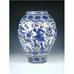 A Saffavid style blue and white vase, the ovoid shape painted in two tones of blue and outlined in..