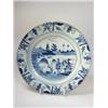 Image 1 : A mid 18th century Chinese blue and white plate painted with a view from an island with trees to an.