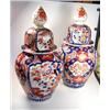 Image 1 : A pair of late 19th century Japanese Imari jars and covers, each painted with alternating garden an.