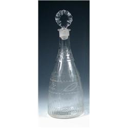 A George III decanter and stopper, the shallow shouldered conical shape with honeycomb faceting on..