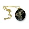 Image 1 : A Victorian oval black locket applied with a pearl set bird in a branch, with photo back, 60mm, sus.