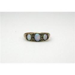 A 9ct gold three stone opal ring with diamond chip spacers    £70-100...