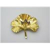 Image 1 : An 18ct gold brooch modelled as a leaf, the centre decorated with three sprigs of three sapphires,..