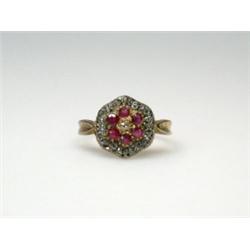 An 18ct gold diamond and ruby cluster ring    £70-100...