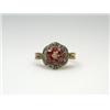 Image 1 : An 18ct gold diamond and ruby cluster ring    £70-100...