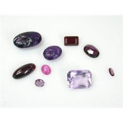 A small quantity of loose gemstones including two carved amethyst coloured cabochons    £40-60...