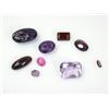 Image 1 : A small quantity of loose gemstones including two carved amethyst coloured cabochons    £40-60...