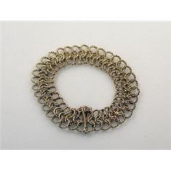 A 9ct gold fancy link bracelet formed from three rows of interlocking rings, with slide clasp, 40gm.
