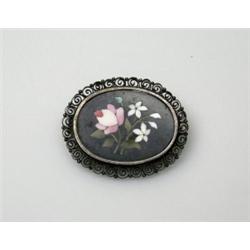 A small silver brooch inset with a floral micromosaic panel, 30mm diameter   £30-60...