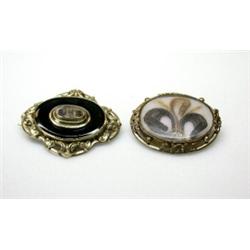 Two Victorian pinchbeck framed mourning brooches, one cased by Mappin & Webb, 50mm diameter, each w.