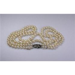 A double string of graduated cultured pearls (149) with an 18ct white gold and diamond clasp   £400.