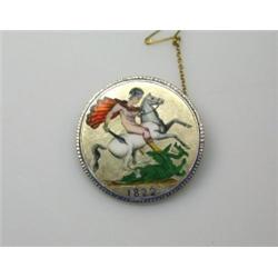 A brooch formed from a George IV silver crown coin decorated in coloured enamels   £25-35...
