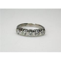 An 18ct white gold and diamond half eternity ring set with five modern brilliant cut stones   £850-.