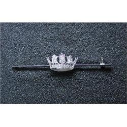 A blade brooch applied with a diamond set naval crown, 60mm, in fitted Goldsmiths' and Silversmiths.
