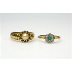 An 18ct gold and platinum ring with emerald and diamond cluster and a gold ring with single pearl i.