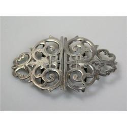 A late Victorian silver belt buckle, scroll pierced, Birmingham 1900, 8.5cm, 1.25oz    £30-50...