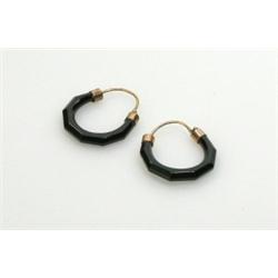 A pair of gold and jet hoop earrings     £40-60...