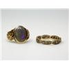 Image 1 : A gold and opal ring set with an oval cabochon stone above leaf shoulders and a 9ct gold eternity r.