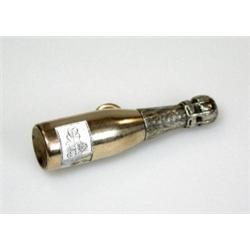 A gold plated retractable pencil by Sampson Mordan, modelled as a champagne bottle, the white ename.