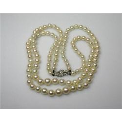 A double string of graduated cultured pearls (116) with 9ct white gold diamond clasp   £1,500-2,000.