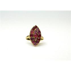 An 18ct gold and ruby ring with marquise shape cluster   £100-120...