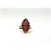Image 1 : An 18ct gold and ruby ring with marquise shape cluster   £100-120...