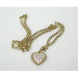 An 18ct gold heart shape pendant set with seventeen modern brilliant cut diamonds, 17mm diameter, s.