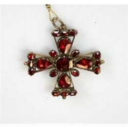 An early 19th century cruciform brooch set with garnets, 38mm   £250-350...