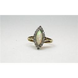 An 18ct gold marquise shape ring with cabochon opal within a diamond surround   £180-220...