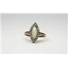 Image 1 : An 18ct gold marquise shape ring with cabochon opal within a diamond surround   £180-220...