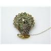 Image 1 : A gold brooch modelled as a peacock with tail feathers displayed, decorated with emeralds and rose..