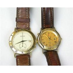 A Gentleman's gold plated wristwatch with ivory coloured dial, signed Gucci, the bezel engraved wit.