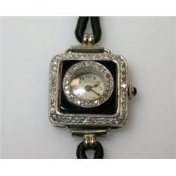 An Art Deco style cocktail watch with platinum and enamel case with diamond set border and bezel, t.