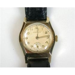 A 9ct gold cased Lady's or boy's wristwatch with silvered round dial with raised Arabic numerals, s.
