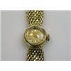 Image 1 : An 18ct gold cased Lady's wristwatch, the circular gold coloured dial with baton numerals, signed P.