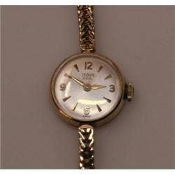 A Lady's 9ct gold cased wristwatch with circular silvered dial with baton and Arabic numerals, sign.