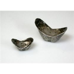 Two Chinese silver boat shaped sycee, 18gm and 64gm (2)   £30-50...