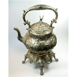 A Victorian electroplate teakettle on stand, the kettle with compressed pear shaped body engraved a.